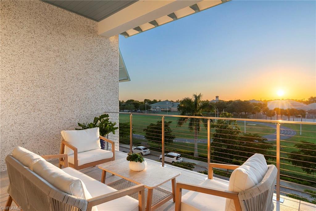 201 8th Street South, Unit 301 Naples, FL 34102 - Photo 16 of 43 a view of a roof deck with couches and sky view