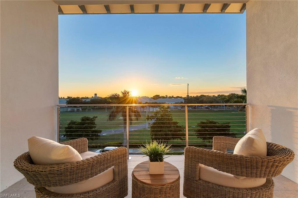 201 8th Street South, Unit 301 Naples, FL 34102 - Photo 20 of 43 a outdoor living space with patio furniture and a potted plant