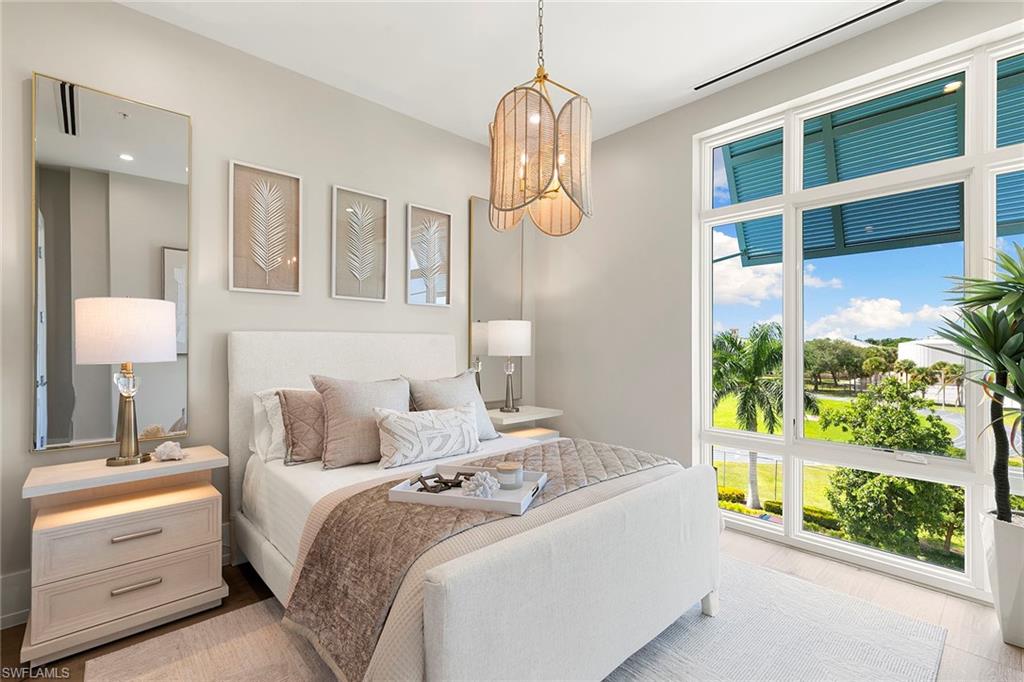 201 8th Street South, Unit 301 Naples, FL 34102 - Photo 25 of 43 a bedroom with bed and a window