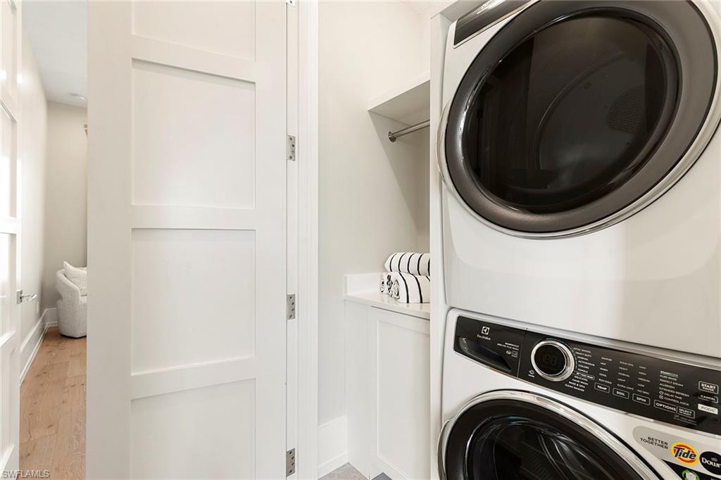 201 8th Street South, Unit 301 Naples, FL 34102 - Photo 28 of 43 a utility room with dryer and washer