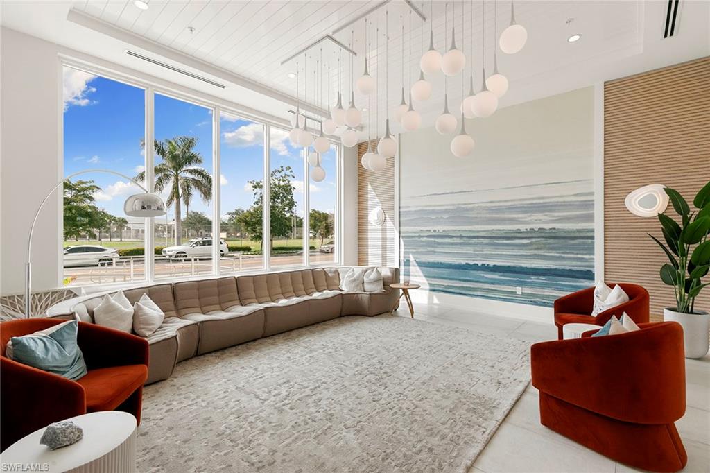 201 8th Street South, Unit 301 Naples, FL 34102 - Photo 37 of 43 a living room with furniture and a large window