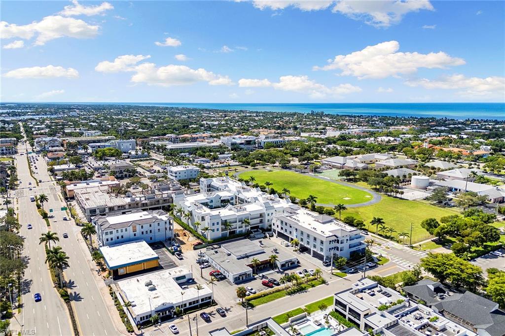 201 8th Street South, Unit 301 Naples, FL 34102 - Photo 42 of 43 an aerial view of a residential houses with outdoor space
