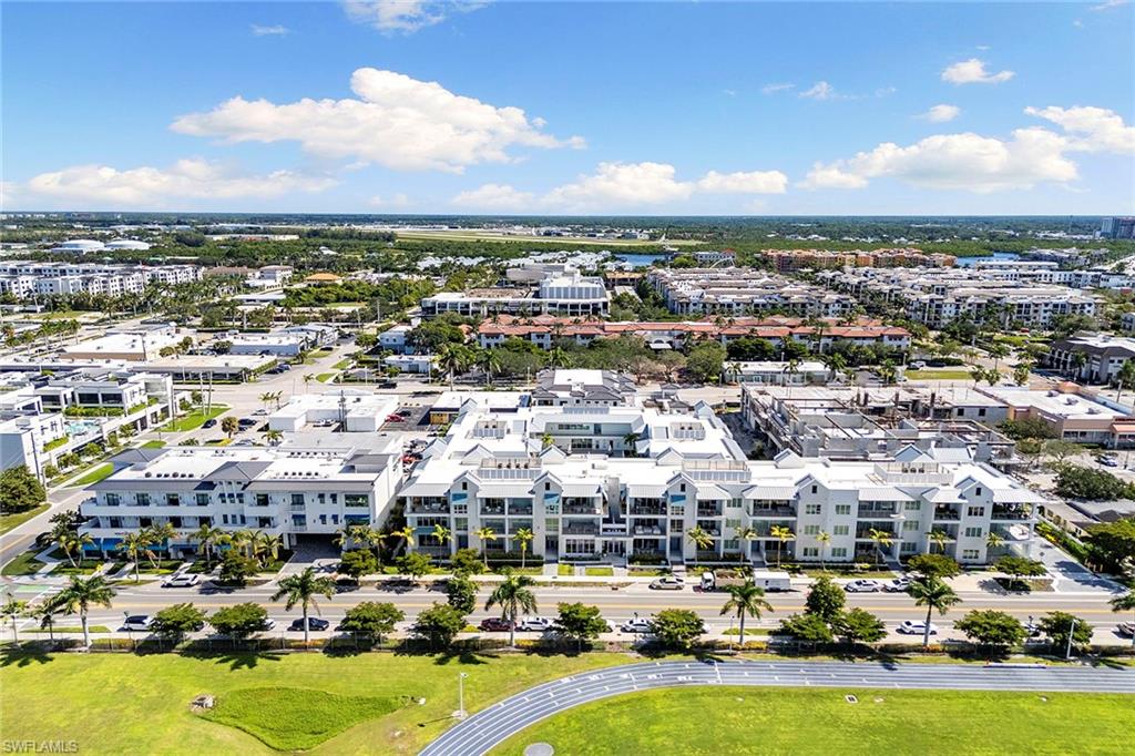 201 8th Street South, Unit 301 Naples, FL 34102 - Photo 43 of 43 an aerial view of residential building with parking space