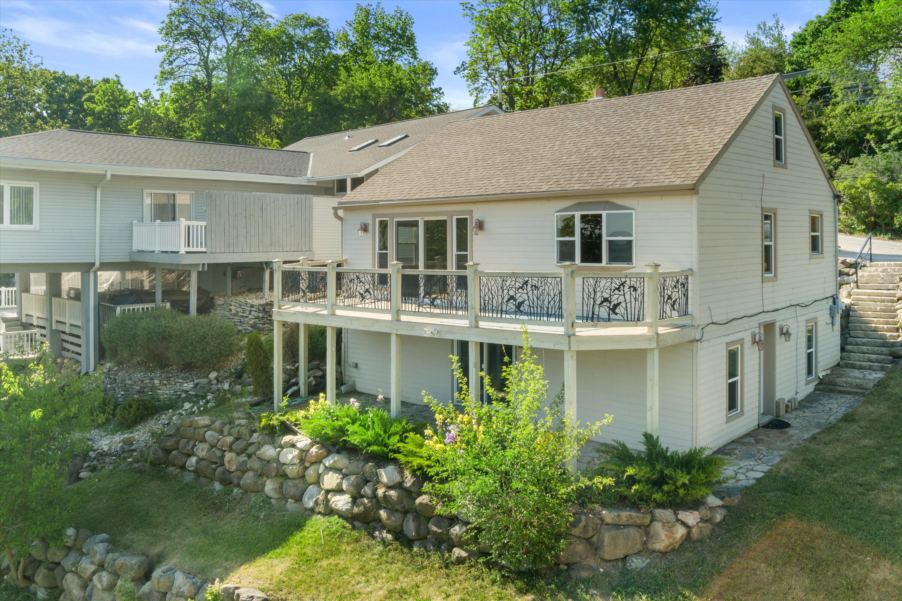 N39W27485 Hillside Grove Road Pewaukee, WI 53072 - Photo 1 of 43 Lake side of home