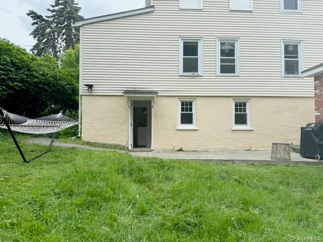 12 Grove Street, Unit C Beacon, NY 12508 - Photo 4 of 13 Back of property with a yard and stucco siding