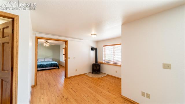 11125 Eureka Road Calhan, CO 80808 - Photo 34 of 44 Hallway featuring light hardwood / wood-style floors