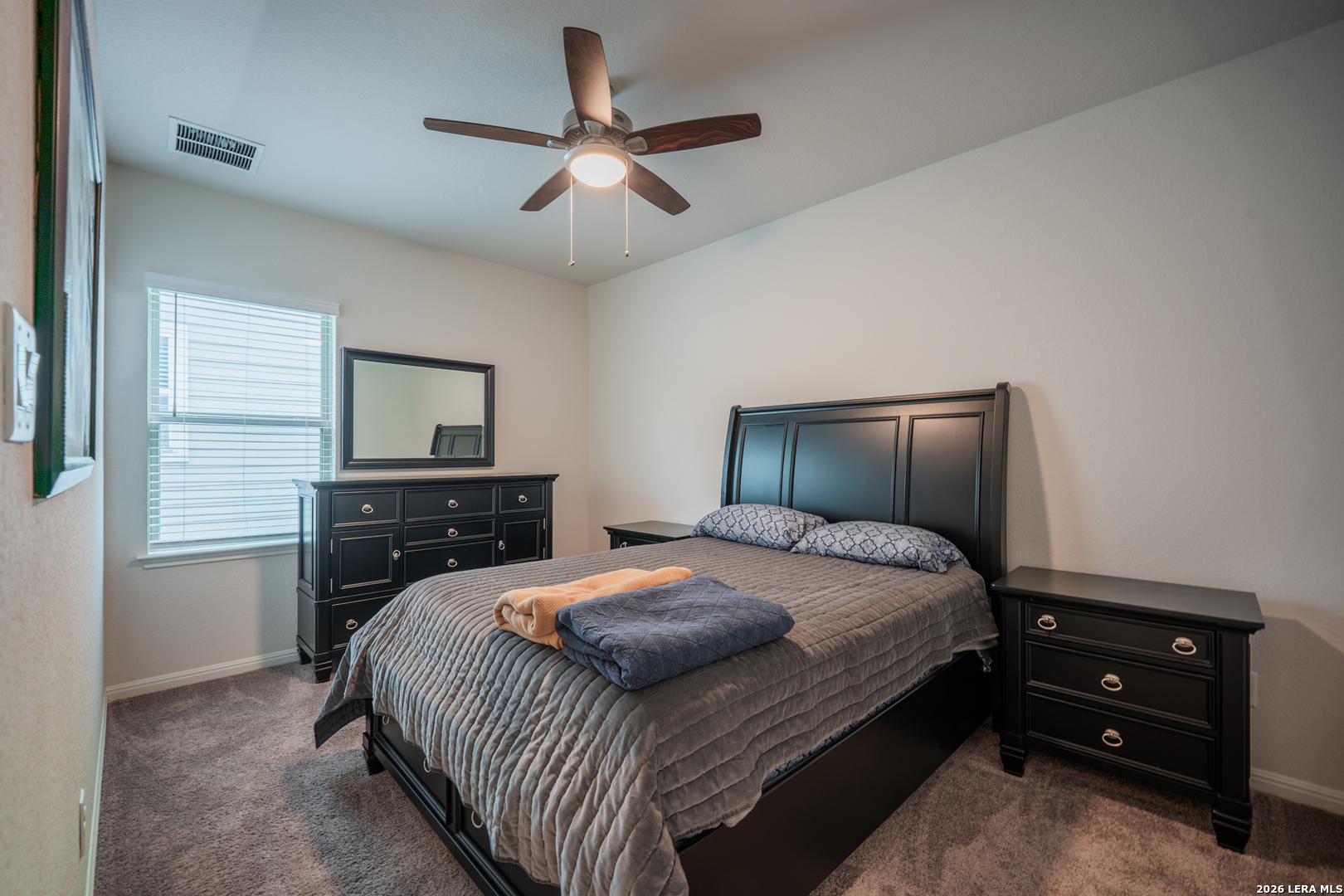 4947 Ranahan Pass St. Hedwig, TX 78152 - Photo 24 of 37 a bedroom with a bed and a tv on dresser