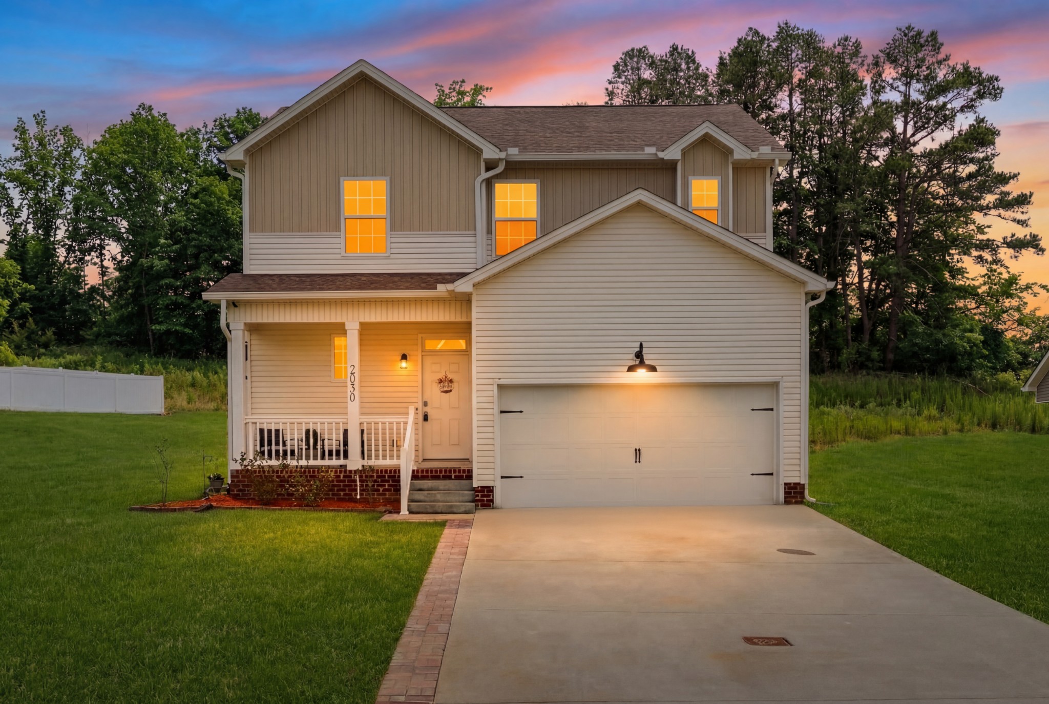 2030 Morgan Court Springfield, TN 37172 - Photo 1 of 29 a front view of a house with a garden and trees