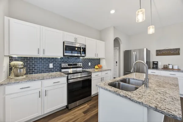 a bathroom with a sink toilet and a mirror