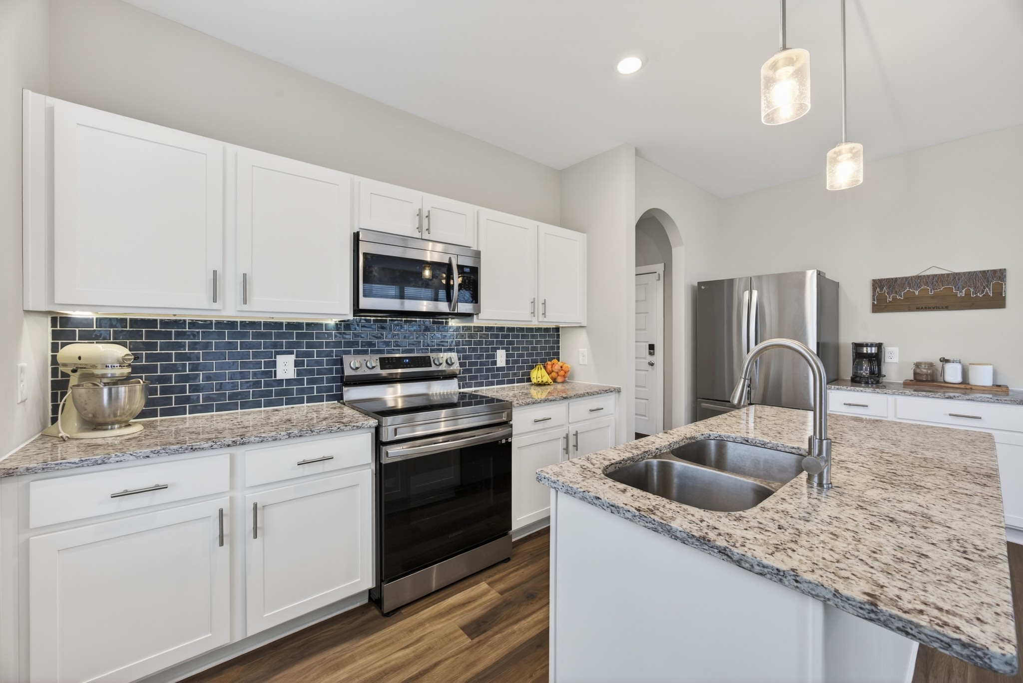 2030 Morgan Court Springfield, TN 37172 - Photo 14 of 29 a kitchen with granite countertop a sink a stove and cabinets