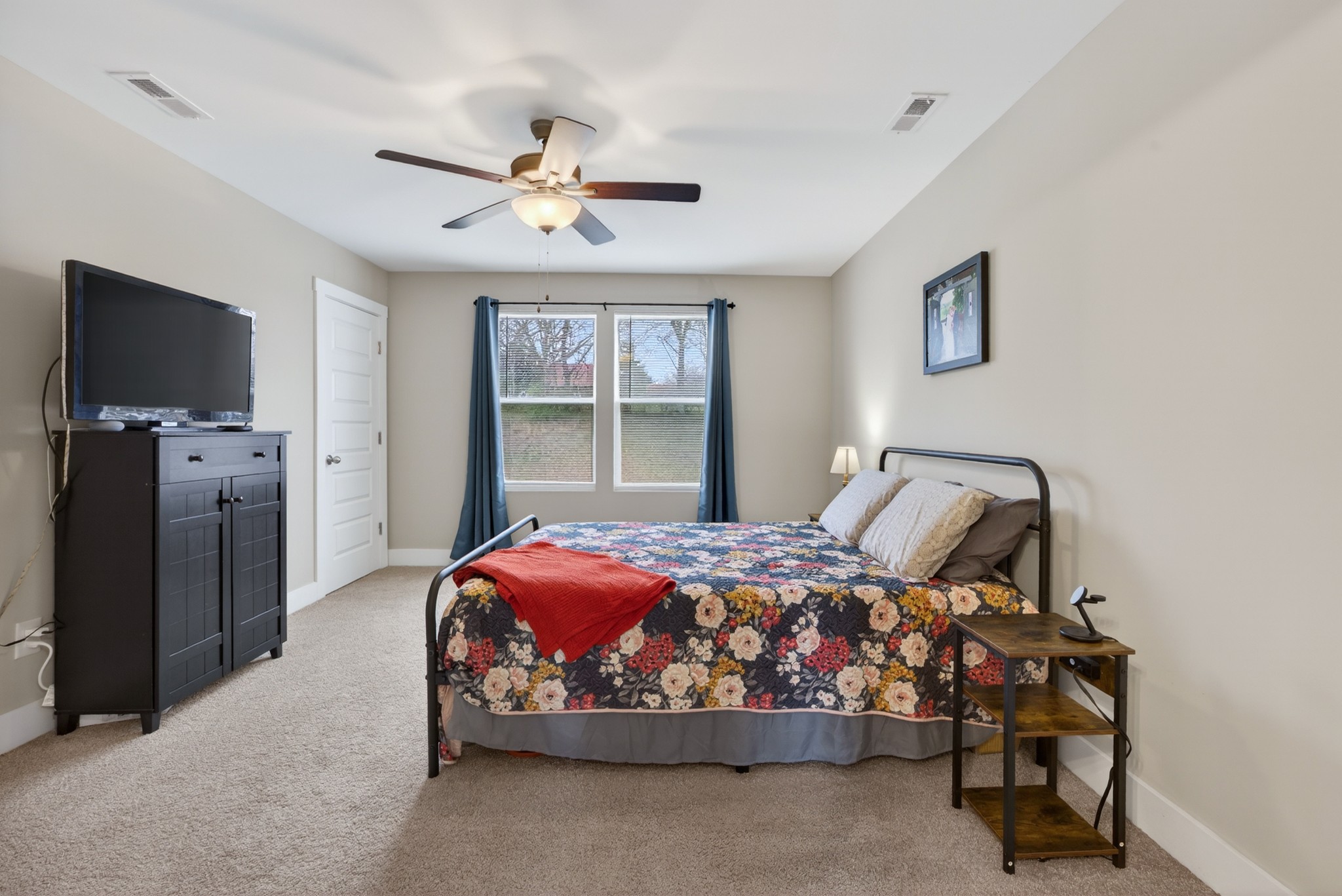 2030 Morgan Court Springfield, TN 37172 - Photo 20 of 29 a bedroom with a bed and a chandelier