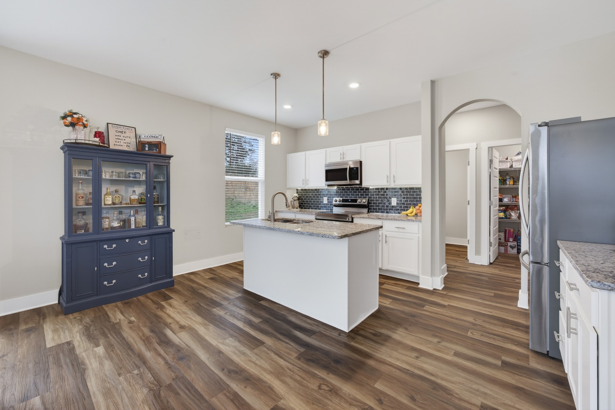 2030 Morgan Court Springfield, TN 37172 - Photo 10 of 29 a kitchen with stainless steel appliances kitchen island granite countertop a stove a sink and a refrigerator
