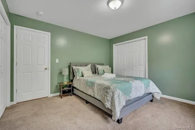 a bed sitting in a room next to a window