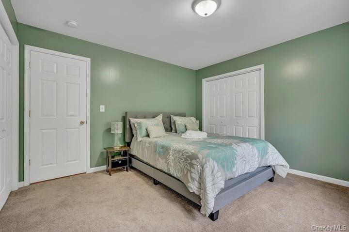 73 Mountain Road Bloomingburg, NY 12721 - Photo 14 of 19 a bed sitting in a room next to a window