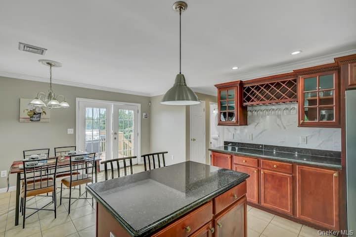 73 Mountain Road Bloomingburg, NY 12721 - Photo 5 of 19 a kitchen with stainless steel appliances granite countertop a sink a stove and a wooden floors