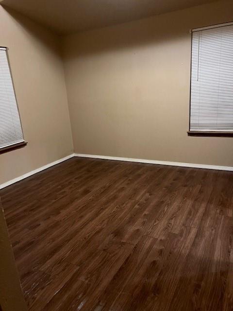 320 Northwest 9th Street Cooper, TX 75432 - Photo 12 of 13 a view of an empty room with wooden floor and a window