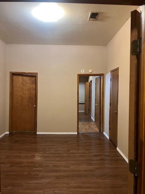 320 Northwest 9th Street Cooper, TX 75432 - Photo 2 of 13 a view of an empty room with wooden floor