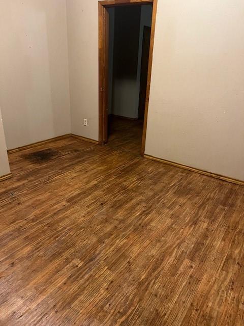 320 Northwest 9th Street Cooper, TX 75432 - Photo 8 of 13 a view of an empty room with wooden floor