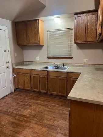 a kitchen with a sink and cabinets