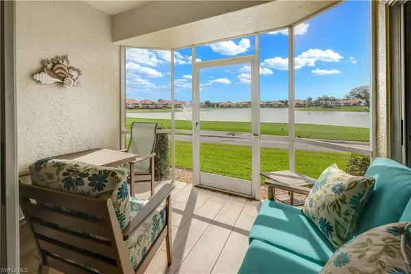 a bedroom with a bed and a view of balcony
