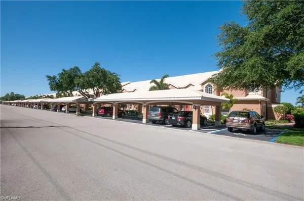 a view of a parked cars in front of a building
