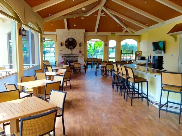 a dining room with lots of tables and chairs