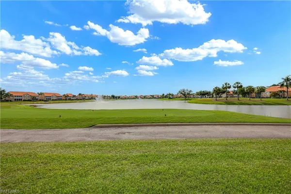 a view of a golf course with a lake