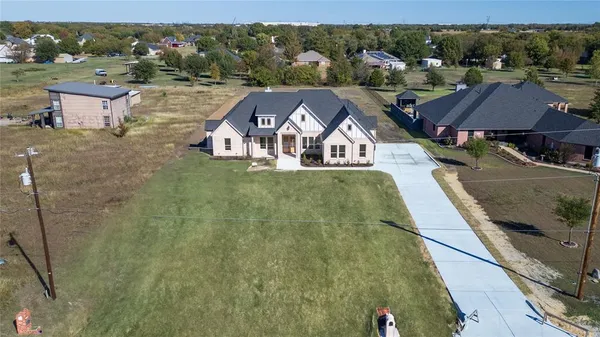 a view of a big house with a big yard