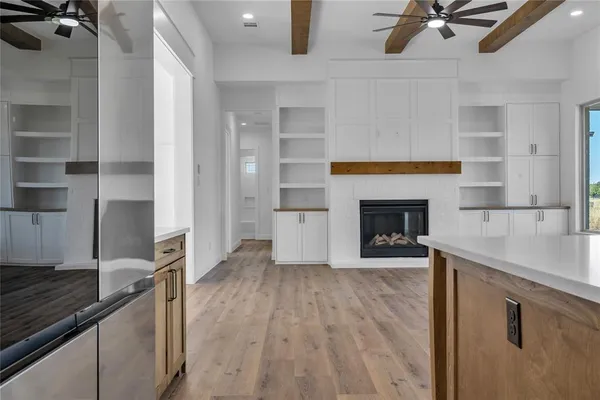 a view of a kitchen with furniture and a fireplace
