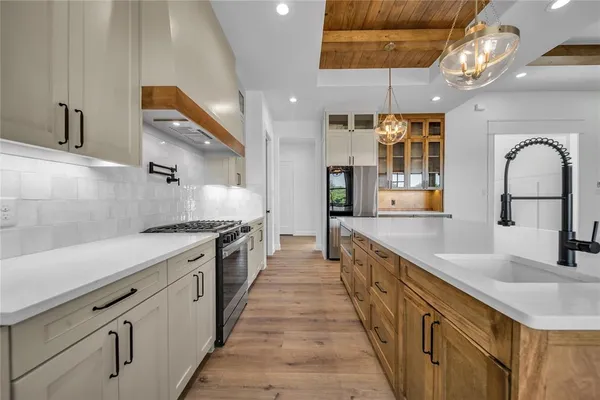 a kitchen with kitchen island granite countertop lots of counter top space