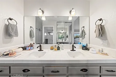 a bathroom with a sink and a mirror