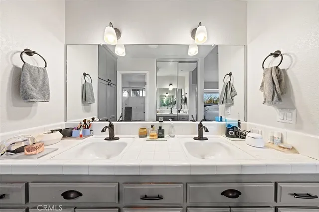 a bathroom with a sink and a mirror