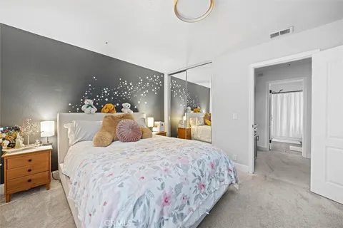 a bedroom with a bed and a closet