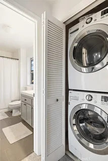 a utility room with sink dryer and washer