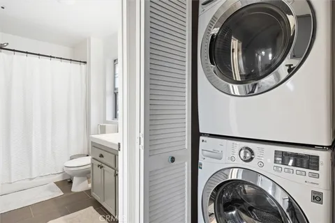 a view of a hallway with washer and dryer