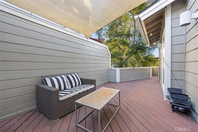 a view of a patio with wooden floor
