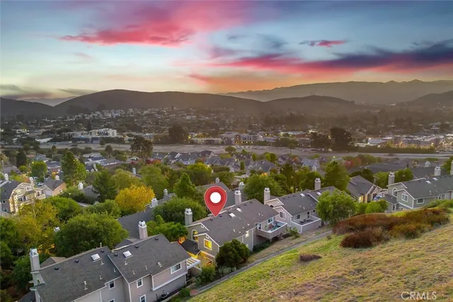 a view of a city with mountains in the background