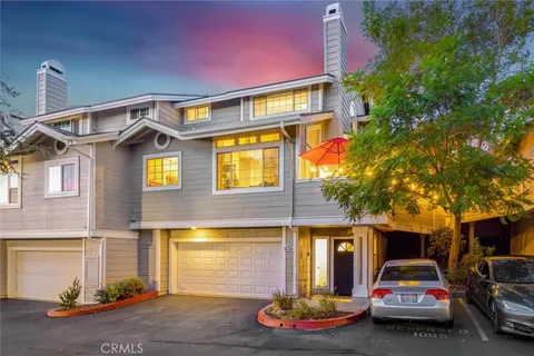 a front view of a house with parking