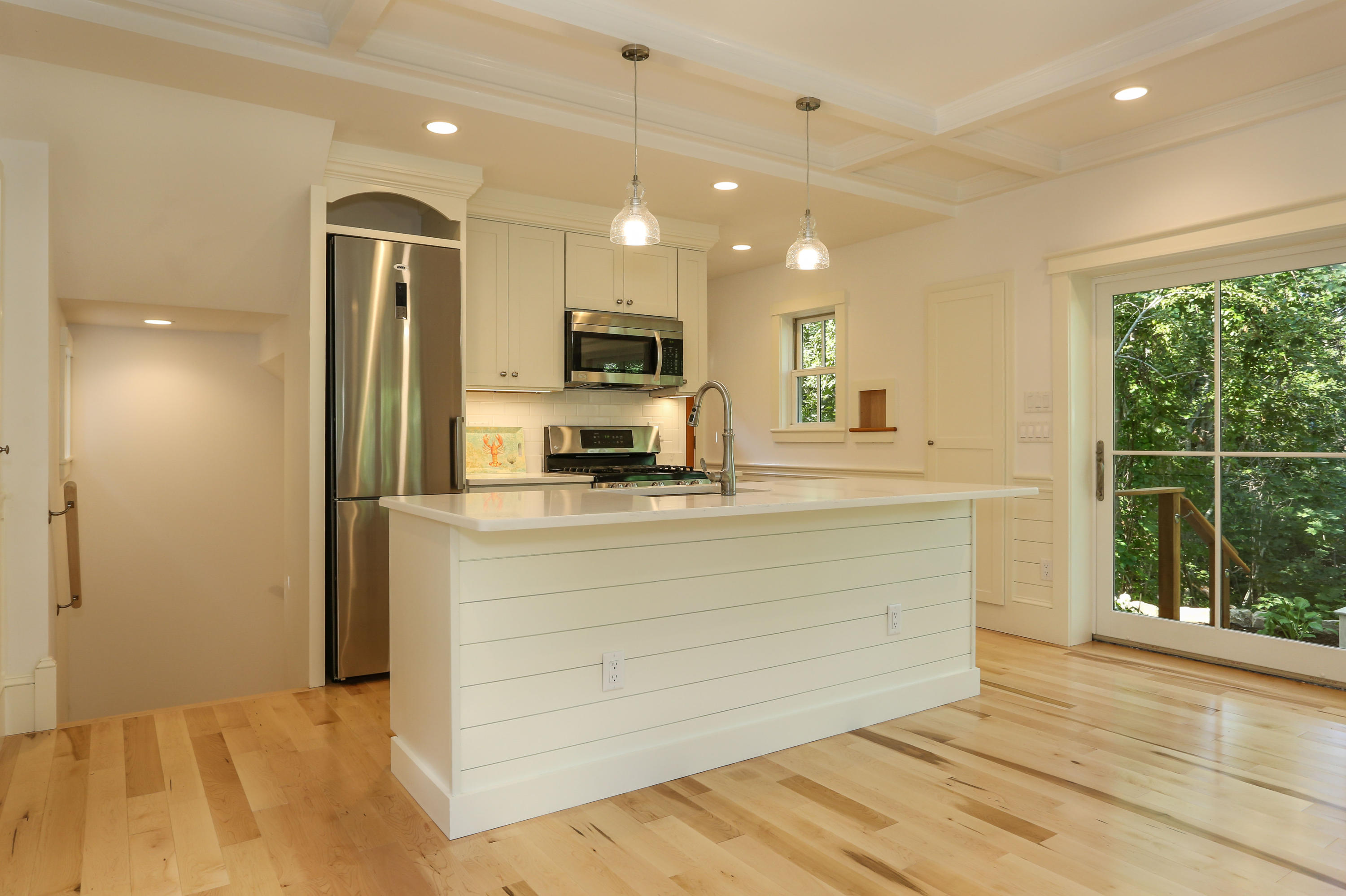 119 Hamblen Farm Road Wellfleet, MA 02667 - Photo 8 of 28 a view of a kitchen with a sink and a large window