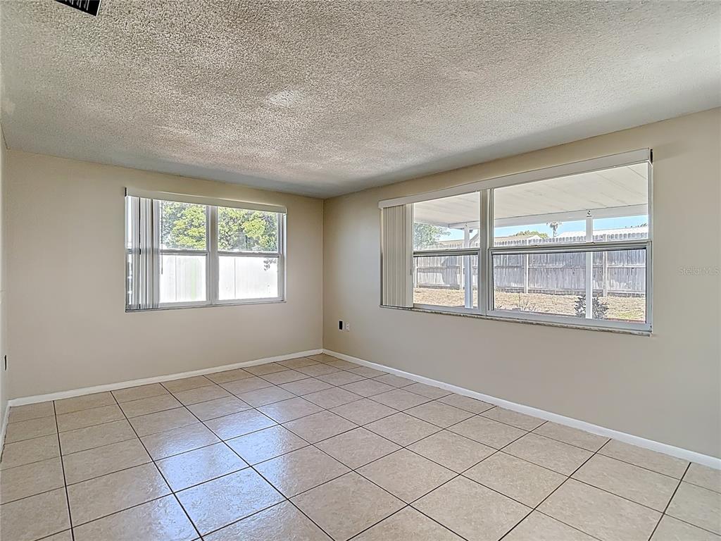 10806 Jason Road Port Richey, FL 34668 - Photo 17 of 46 a view of an empty room with a window