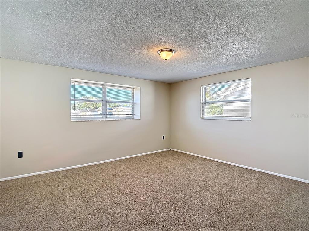 10806 Jason Road Port Richey, FL 34668 - Photo 21 of 46 an empty room with a window