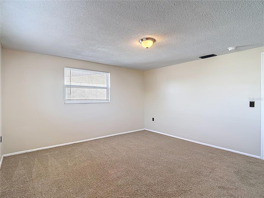 10806 Jason Road Port Richey, FL 34668 - Photo 24 of 46 an empty room with a windows