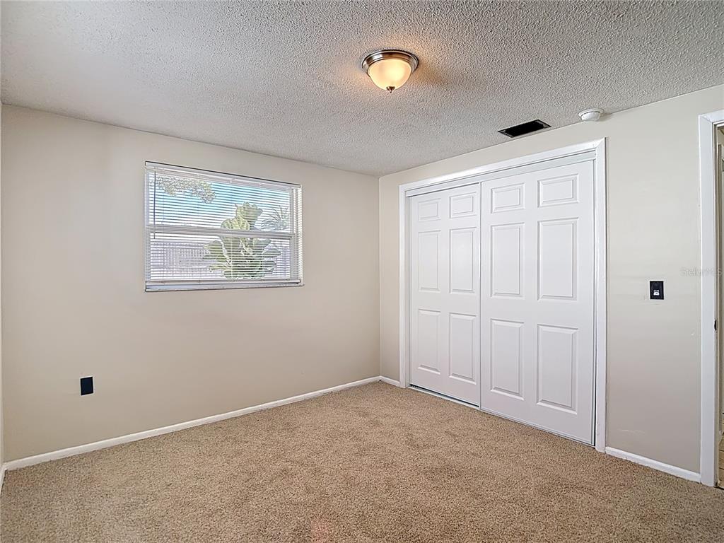 10806 Jason Road Port Richey, FL 34668 - Photo 28 of 46 a view of an empty room with a window