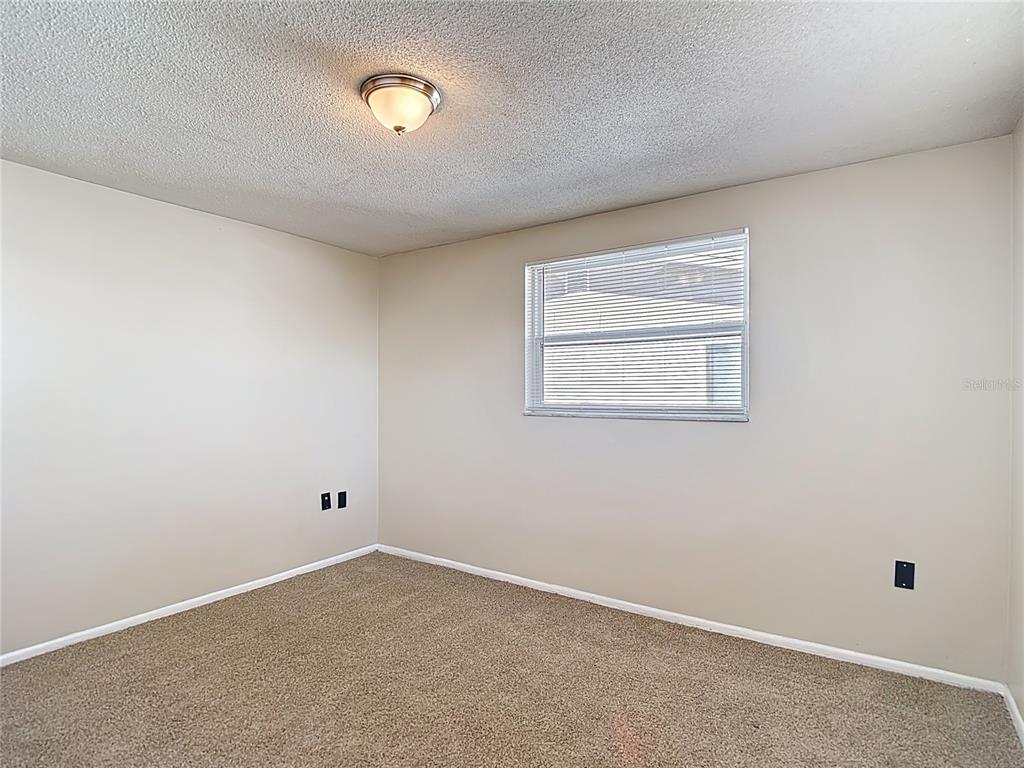 10806 Jason Road Port Richey, FL 34668 - Photo 30 of 46 an empty room with windows