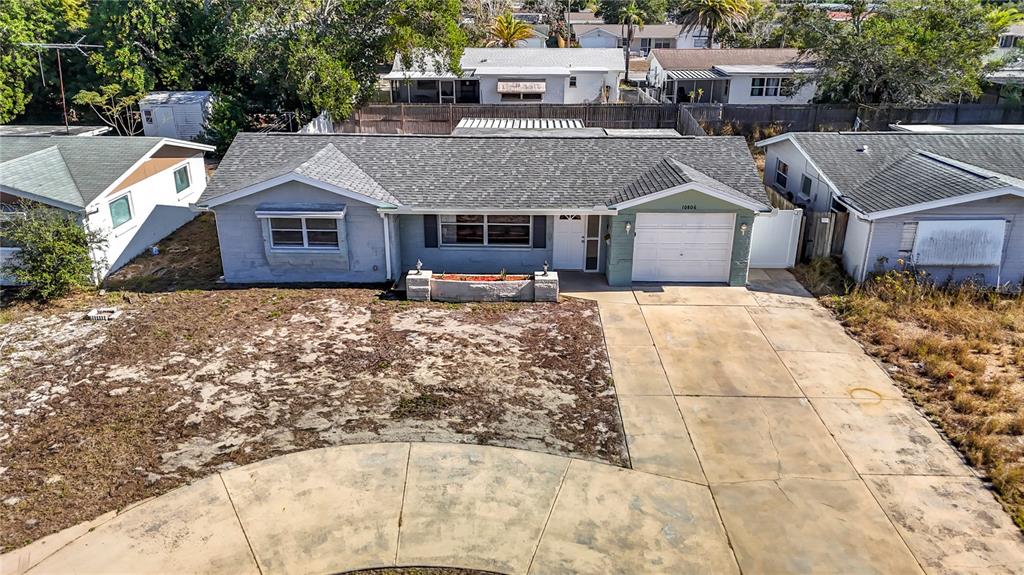 10806 Jason Road Port Richey, FL 34668 - Photo 3 of 46 an aerial view of a house with a yard