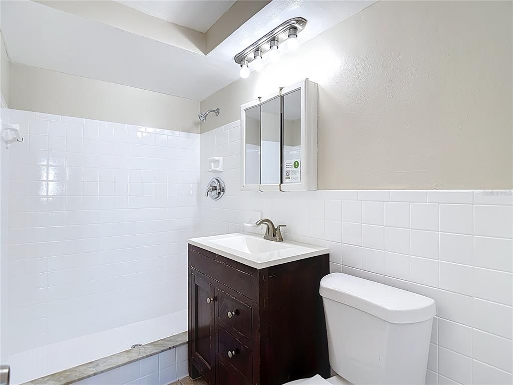 10806 Jason Road Port Richey, FL 34668 - Photo 31 of 46 a bathroom with a sink and a toilet