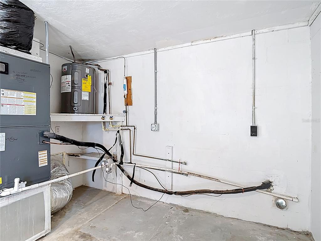 10806 Jason Road Port Richey, FL 34668 - Photo 32 of 46 a room with gym equipment and windows