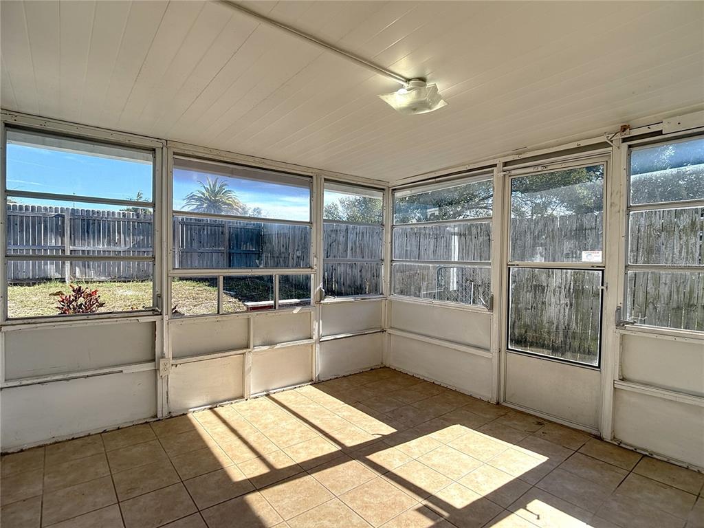 10806 Jason Road Port Richey, FL 34668 - Photo 35 of 46 a bathroom with a tub sink and mirror