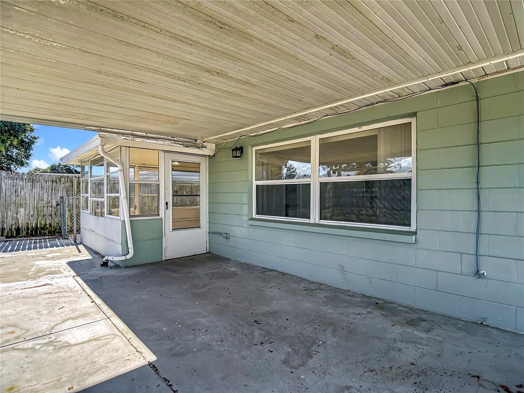 10806 Jason Road Port Richey, FL 34668 - Photo 40 of 46 a view of a house with a wooden deck