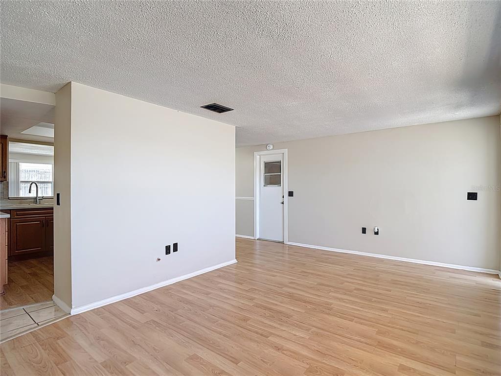 10806 Jason Road Port Richey, FL 34668 - Photo 7 of 46 wooden floor in an empty room
